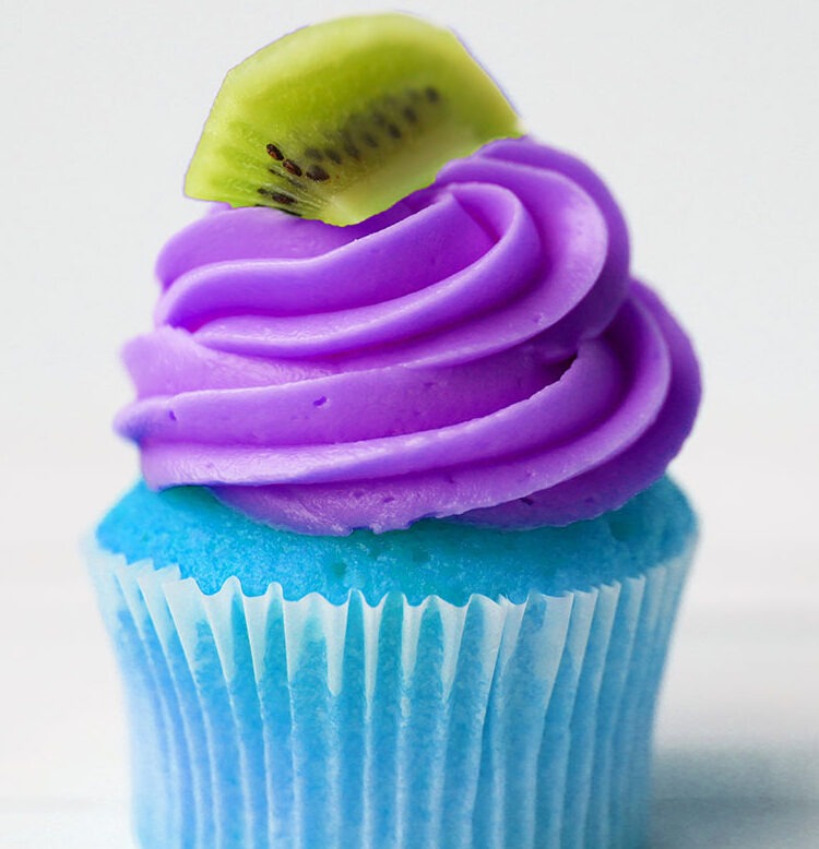 Colorful blue cupcake with color purple cream