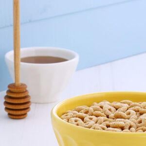 Delicious and nutritious lightly toasted breakfast honey nuts cereal loops on vintage styling