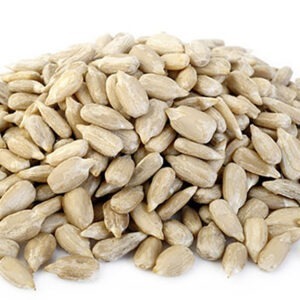peeled sunflower seeds on white background